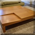 F13. Modern maple coffee table. 9.5"h x 43.5" square 